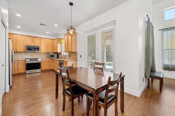 Dining room, Interior, Kitchen, Pendant Lights, Recessed Lighting, Stainless Steel Appliances, Wood Texture Flooring