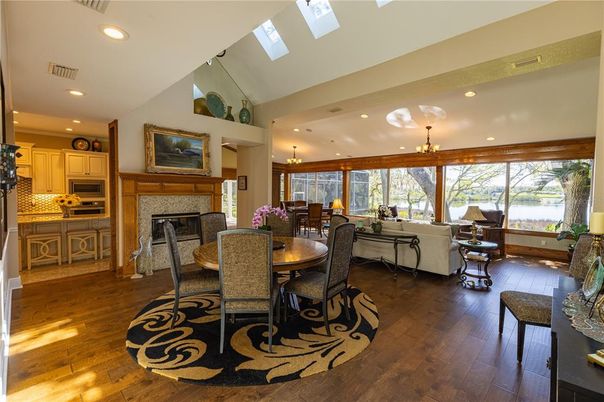 Chandelier, Dining room, Fireplace, Interior, Kitchen, Living room, Recessed Lighting, Wood Texture Flooring