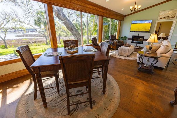 Chandelier, Dining room, Fireplace, Interior, Living room, Recessed Lighting, Wood Texture Flooring