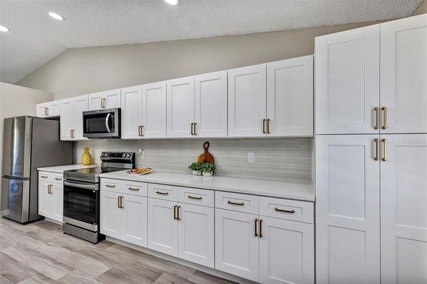 Interior, Kitchen, Recessed Lighting, Stainless Steel Appliances, Wood Texture Flooring