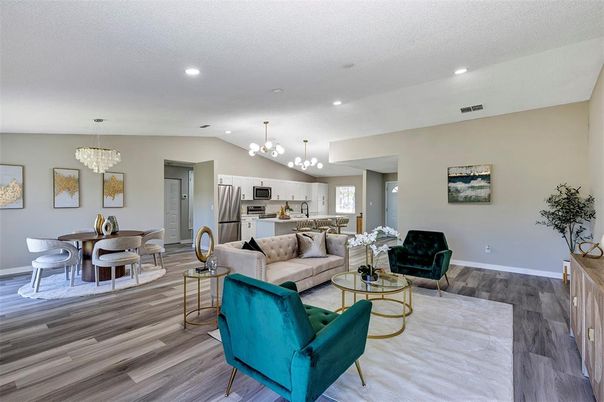 Chandelier, Dining room, Interior, Kitchen, Living room, Pendant Lights, Recessed Lighting, Stainless Steel Appliances, Wood Texture Flooring