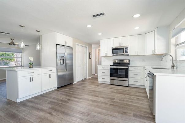 Interior, Kitchen, Pendant Lights, Recessed Lighting, Stainless Steel Appliances, Wood Texture Flooring