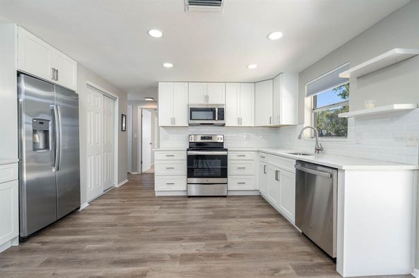 Interior, Kitchen, Recessed Lighting, Stainless Steel Appliances, Wood Texture Flooring
