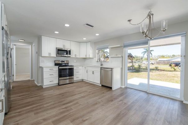 Interior, Kitchen, Pendant Lights, Recessed Lighting, Stainless Steel Appliances, Wood Texture Flooring