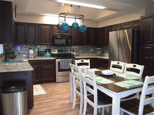 Dining room, Interior, Kitchen, Pendant Lights, Stainless Steel Appliances, Wood Texture Flooring