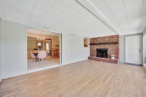Chandelier, Dining room, Fireplace, Interior, Stone Walls, Wood Texture Flooring