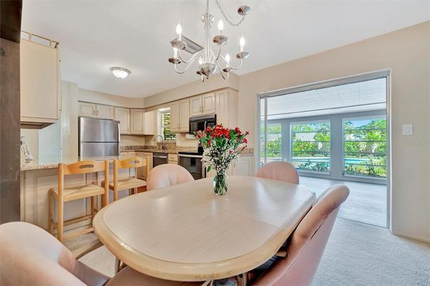 Chandelier, Dining room, Interior, Kitchen, Stainless Steel Appliances, Wood Texture Flooring
