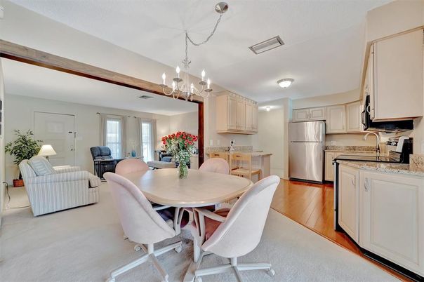 Chandelier, Dining room, Interior, Kitchen, Living room, Stainless Steel Appliances, Wood Texture Flooring