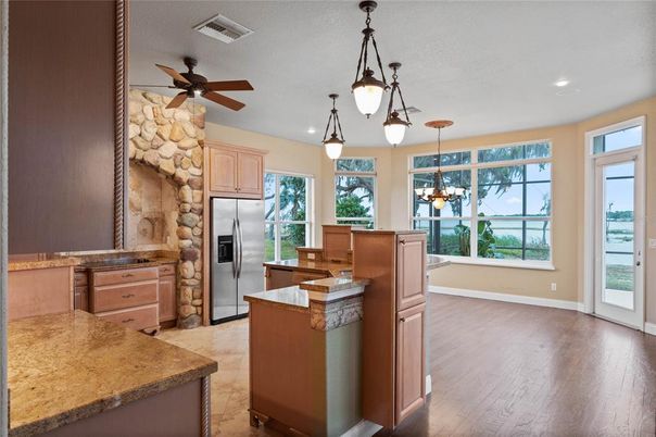 Interior, Kitchen, Pendant Lights, Recessed Lighting, Stainless Steel Appliances, Stone Walls, Wood Texture Flooring