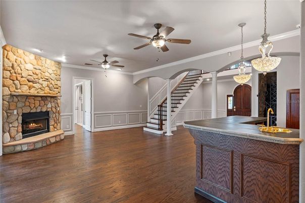 Fireplace, Interior, Pendant Lights, Recessed Lighting, Stone Walls, Wood Texture Flooring