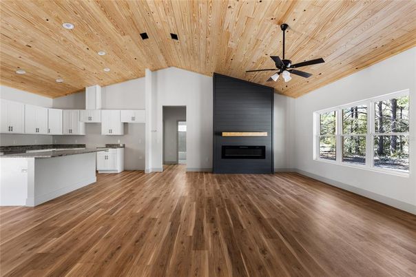 Empty room, Fireplace, Interior, Kitchen, Recessed Lighting, Wooden Ceilings, Wood Texture Flooring