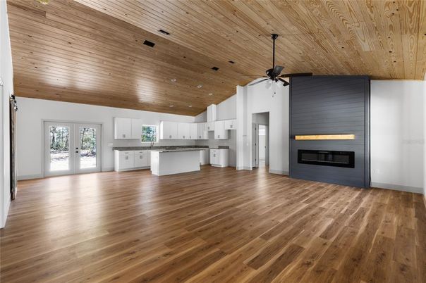 Empty room, Fireplace, Interior, Kitchen, Recessed Lighting, Wooden Ceilings, Wood Texture Flooring