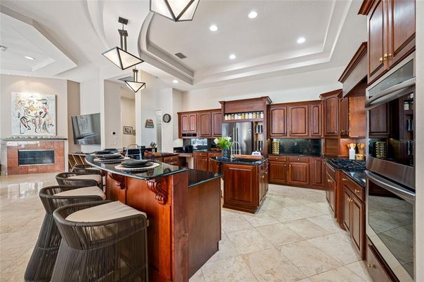 Fireplace, Interior, Kitchen, Pendant Lights, Recessed Lighting, Stainless Steel Appliances