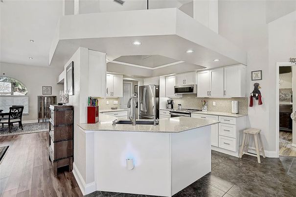 Dining room, Interior, Kitchen, Recessed Lighting, Stainless Steel Appliances, Wood Texture Flooring