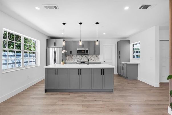 Interior, Kitchen, Pendant Lights, Recessed Lighting, Stainless Steel Appliances, Wood Texture Flooring