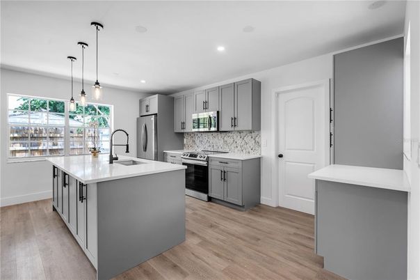 Interior, Kitchen, Pendant Lights, Recessed Lighting, Stainless Steel Appliances, Wood Texture Flooring