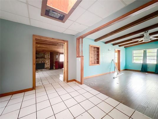 Empty room, Fireplace, Interior, Stone Walls, Wooden Beams, Wood Texture Flooring