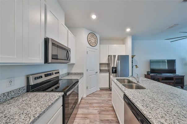 Interior, Kitchen, Recessed Lighting, Stainless Steel Appliances, Wood Texture Flooring
