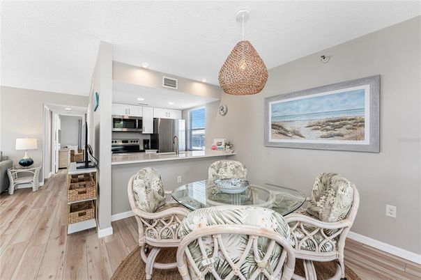 Dining room, Interior, Kitchen, Pendant Lights, Recessed Lighting, Stainless Steel Appliances, Wood Texture Flooring