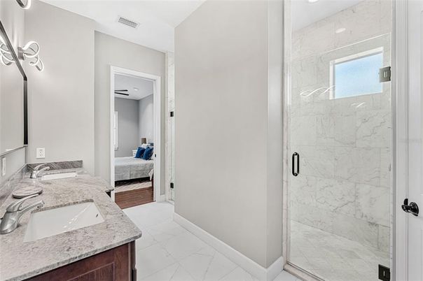 Bathroom, Bedroom, Dual Sink Vanities, Glass Shower, Interior, Marble, Marble Walls, Recessed Lighting