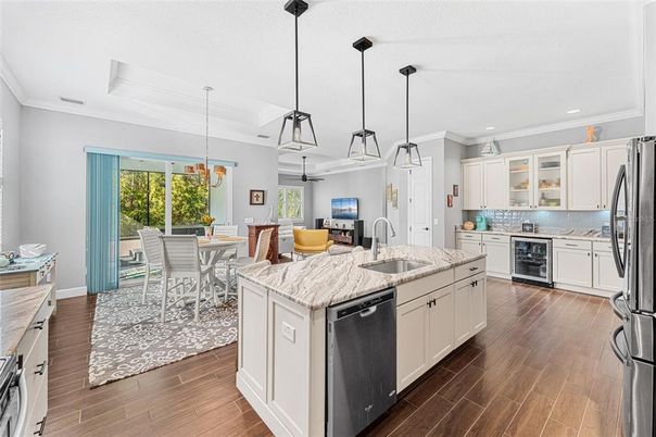 Dining room, Interior, Kitchen, Pendant Lights, Recessed Lighting, Stainless Steel Appliances, Wood Texture Flooring