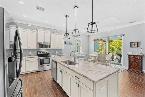 Dining room, Interior, Kitchen, Pendant Lights, Recessed Lighting, Stainless Steel Appliances, Wood Texture Flooring