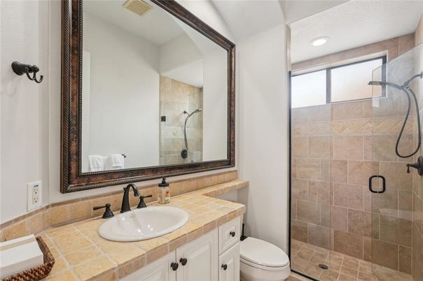 Bathroom, Glass Shower, Interior, Recessed Lighting, Tile Countertops