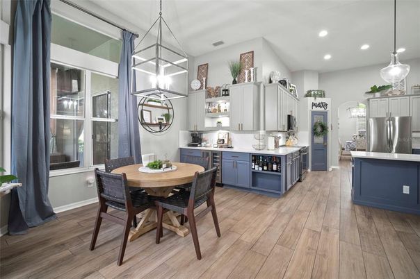 Dining room, Interior, Kitchen, Pendant Lights, Recessed Lighting, Stainless Steel Appliances, Wood Texture Flooring