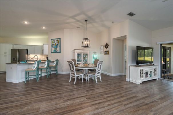 Dining room, Interior, Kitchen, Pendant Lights, Recessed Lighting, Stainless Steel Appliances, Wood Texture Flooring