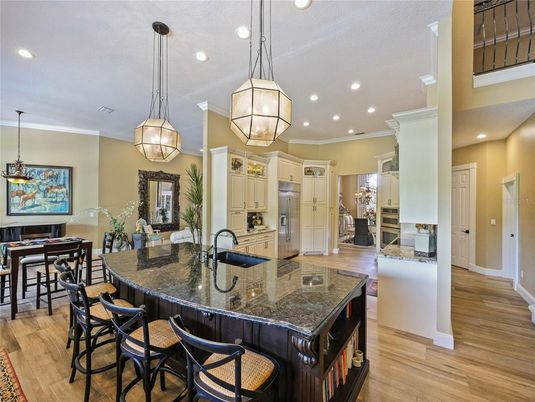Dining room, Interior, Kitchen, Pendant Lights, Recessed Lighting, Stainless Steel Appliances, Wood Texture Flooring