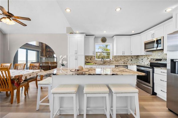 Dining room, Interior, Kitchen, Recessed Lighting, Stainless Steel Appliances, Wood Texture Flooring