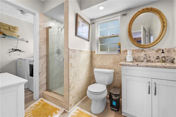 Bathroom, Glass Shower, Interior, Marble Walls, Recessed Lighting, Wood Texture Flooring