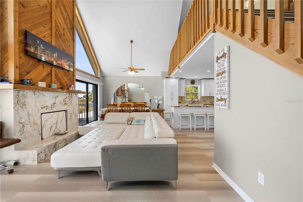 Dining room, Fireplace, Interior, Kitchen, Living room, Recessed Lighting, Wood Texture Flooring, Wooden Walls