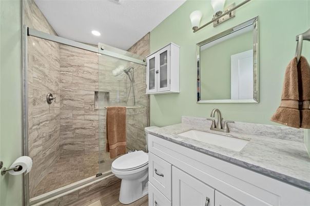 Bathroom, Glass Shower, Interior, Marble Walls, Recessed Lighting, Wood Texture Flooring