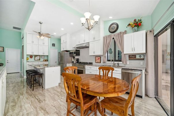 Chandelier, Dining room, Interior, Kitchen, Marble, Recessed Lighting, Stainless Steel Appliances