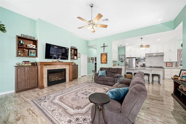 Fireplace, Interior, Kitchen, Living room, Recessed Lighting, Stainless Steel Appliances, Wood Texture Flooring