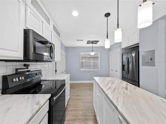 Interior, Kitchen, Pendant Lights, Recessed Lighting, Stainless Steel Appliances, Wood Texture Flooring