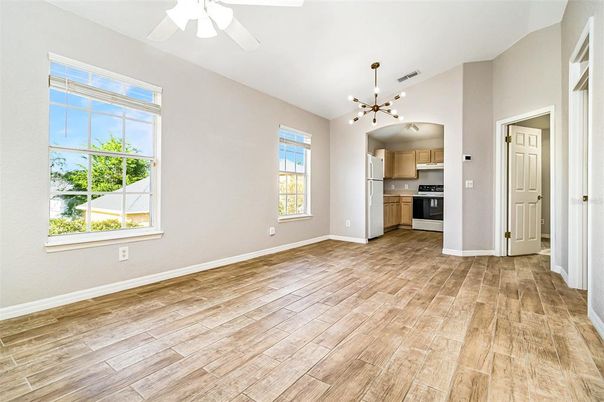 Empty room, Interior, Kitchen, Pendant Lights, Stainless Steel Appliances, Wood Texture Flooring
