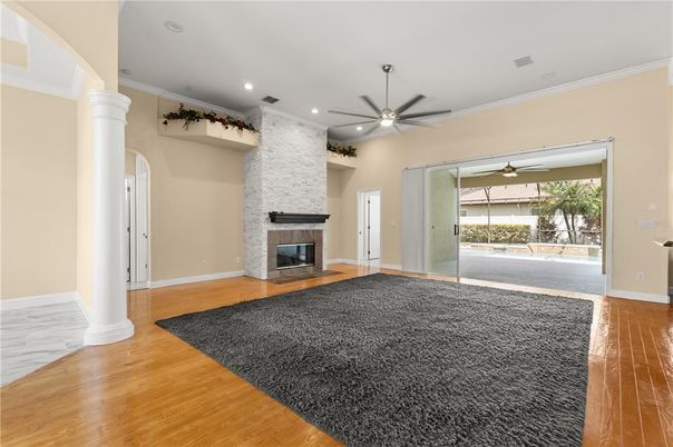 Empty room, Fireplace, Interior, Recessed Lighting, Stone Walls, Wood Texture Flooring