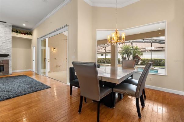 Chandelier, Dining room, Fireplace, Interior, Recessed Lighting, Wood Texture Flooring