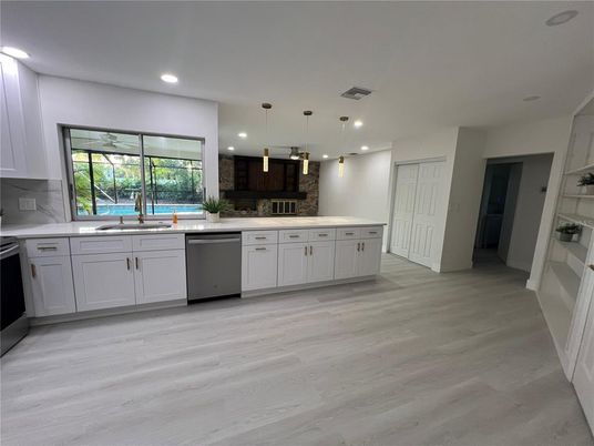 Interior, Kitchen, Pendant Lights, Recessed Lighting, Stainless Steel Appliances, Wood Texture Flooring