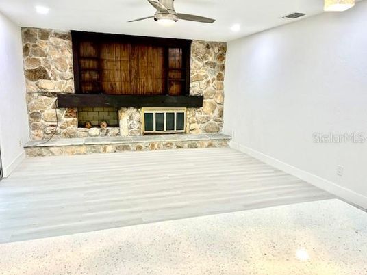 Fireplace, Interior, Recessed Lighting, Stone Walls, Wood Texture Flooring