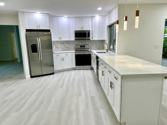 Interior, Kitchen, Pendant Lights, Recessed Lighting, Stainless Steel Appliances, Wood Texture Flooring