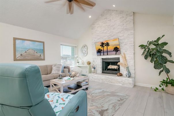 Fireplace, Interior, Living room, Recessed Lighting, Stone Walls, Wood Texture Flooring