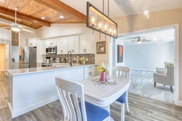 Dining room, Interior, Kitchen, Pendant Lights, Recessed Lighting, Stainless Steel Appliances, Wooden Beams, Wooden Ceilings, Wood Texture Flooring