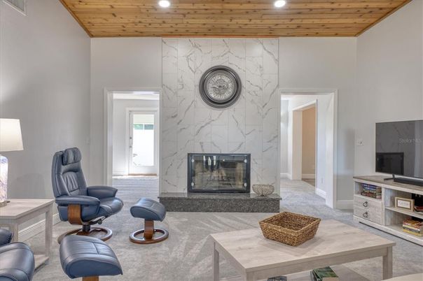 Fireplace, Interior, Living room, Marble Walls, Recessed Lighting, Wooden Ceilings