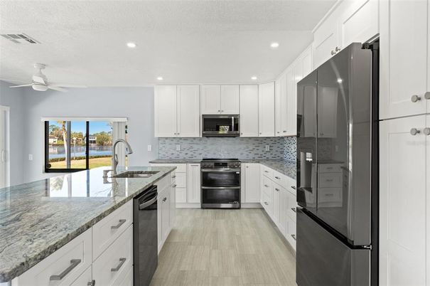 Interior, Kitchen, Recessed Lighting, Stainless Steel Appliances, Wood Texture Flooring