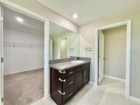 Bathroom, Dual Sink Vanities, Interior, Recessed Lighting, Walk-in Closets