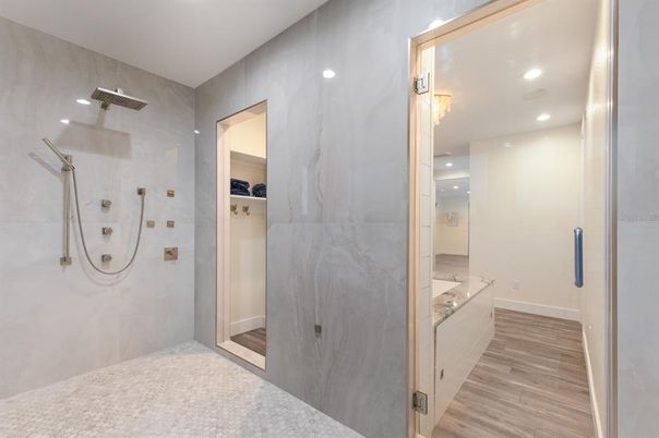 Bathroom, Glass Shower, Interior, Marble Walls, Recessed Lighting, Wood Texture Flooring