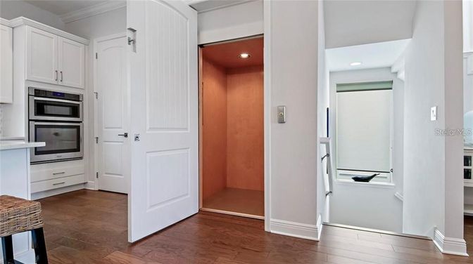 Interior, Kitchen, Recessed Lighting, Stainless Steel Appliances, Wood Texture Flooring, Wooden Walls